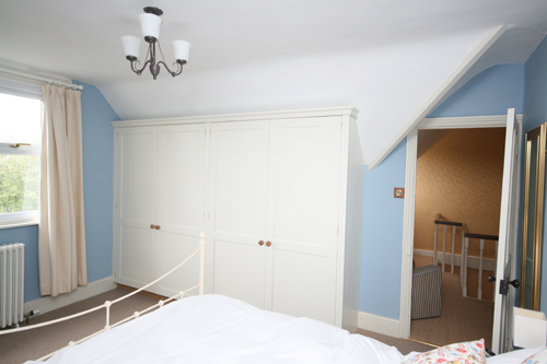 Hand-painted bespoke wardrobes. Fitted to pitched roof. Enlargement 1 ( Two pictures Total = 0.8 MB)